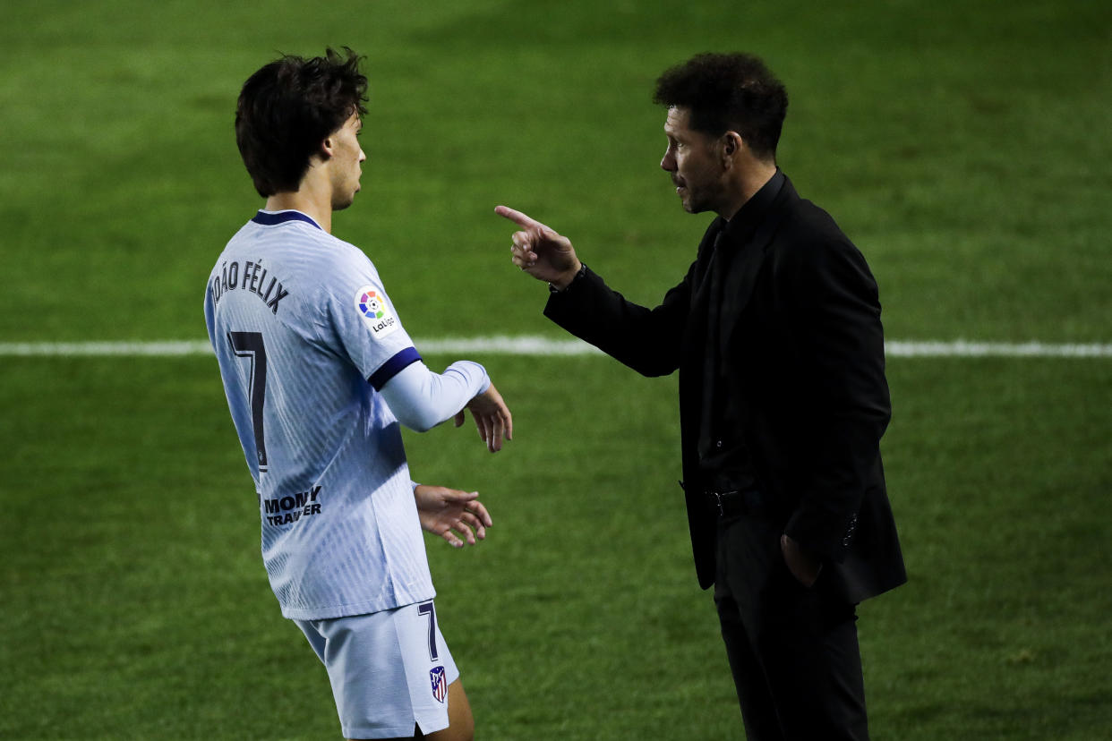 PAMPLONA, SPAIN - JUNE 17: (L-R) Joao Felix of Atletico Madrid, coach Diego Simeone of Atletico Madrid during the La Liga Santander  match between Osasuna v Atletico Madrid at the El Sadar stadium on June 17, 2020 in Pamplona Spain (Photo by David S. Bustamante/Soccrates/Getty Images)