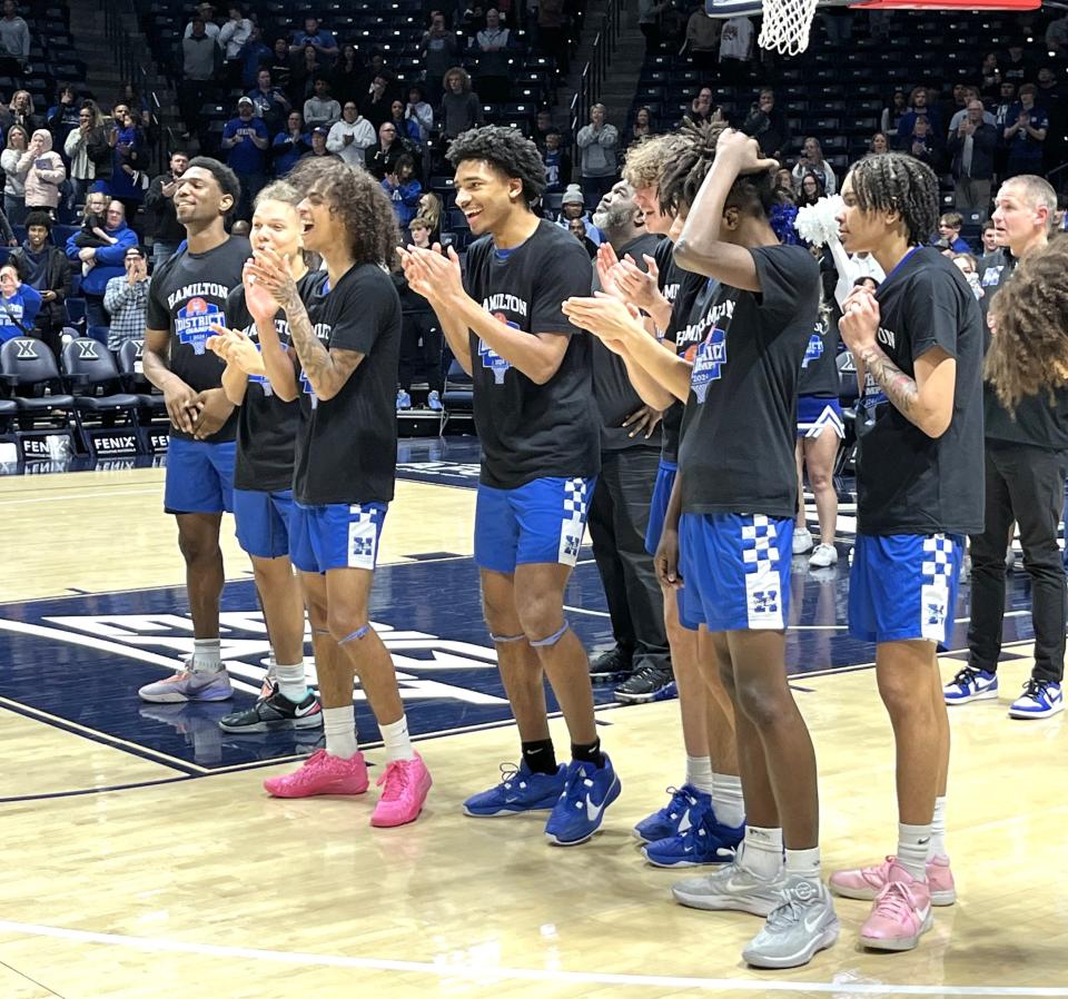 Hamiton celebrates its district championship after beating Sycamore March 10, 2024 at the Cintas Center.