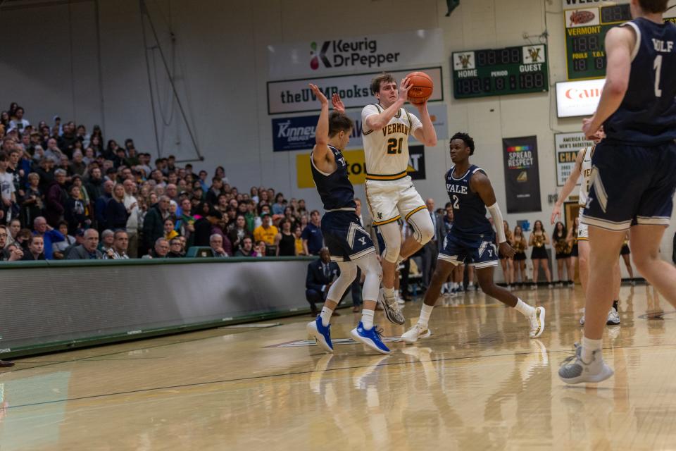 Vermont's TJ Long beats the buzzer to tie Yale on Dec. 2, 2023 at Patrick Gym. Long was fouled on the shot and converted the 4-point play as Vermont stunned the Bulldogs 66-65.