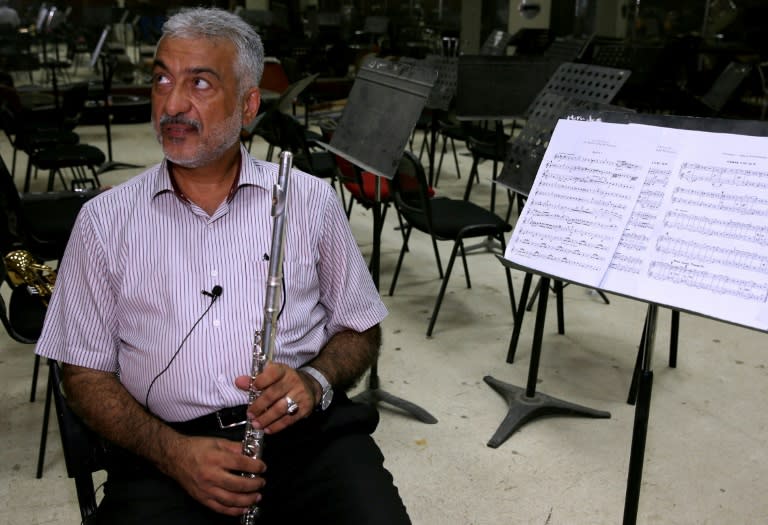 Saad al-Dujaily, an obstetrician and a flutist, is now entitled to only one salary. "In Iraq, we're proud to have more than one job, to have more than one love, to practise two professions with the same love and passion," he says