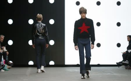 Models present creations from the Topman Design Autumn/Winter 2015 collection during "London Collections: Men" in London January 9, 2015. REUTERS/Suzanne Plunkett