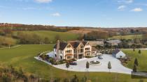 <p>This sprawling five-bedroom house can be found deep in the Essex countryside, set within an excess of 52 acres of private land. All five bedrooms have <a href="https://www.housebeautiful.com/uk/decorate/bedroom/a30966899/walk-in-wardrobe-ideas/" rel="nofollow noopener" target="_blank" data-ylk="slk:walk-in wardrobes;elm:context_link;itc:0;sec:content-canvas" class="link ">walk-in wardrobes</a> and en-suites, and it has its own Olympic-sized equestrian centre. The enormous mansion also boasts an impressive underground car port, big enough to accommodate a fleet of 10 supercars! If that wasn't enough, the property is also home to an indoor swimming pool, complete with a waterfall and jacuzzi, as well as a sauna, steam room, cinema room, and a home gym. </p><p><a class="link " href="https://www.rightmove.co.uk/properties/70432788#/" rel="nofollow noopener" target="_blank" data-ylk="slk:TOUR NOW;elm:context_link;itc:0;sec:content-canvas">TOUR NOW</a></p><p><strong>Like this article?<a href="https://hearst.emsecure.net/optiext/cr.aspx?ID=DR9UY9ko5HvLAHeexA2ngSL3t49WvQXSjQZAAXe9gg0Rhtz8pxOWix3TXd_WRbE3fnbQEBkC%2BEWZDx" rel="nofollow noopener" target="_blank" data-ylk="slk:Sign up to our newsletter;elm:context_link;itc:0;sec:content-canvas" class="link ">Sign up to our newsletter</a> to get more articles like this delivered straight to your inbox.</strong></p><p><a class="link " href="https://hearst.emsecure.net/optiext/cr.aspx?ID=DR9UY9ko5HvLAHeexA2ngSL3t49WvQXSjQZAAXe9gg0Rhtz8pxOWix3TXd_WRbE3fnbQEBkC%2BEWZDx" rel="nofollow noopener" target="_blank" data-ylk="slk:SIGN UP;elm:context_link;itc:0;sec:content-canvas">SIGN UP</a></p>