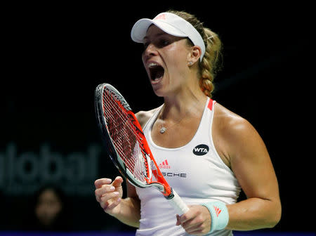 Tennis - Singapore WTA Finals Round Robin Singles - Singapore Indoor Stadium, Singapore - 25/10/2016 - Angelique Kerber of Germany celebrates a point against Simona Halep of Romania REUTERS/Edgar Su