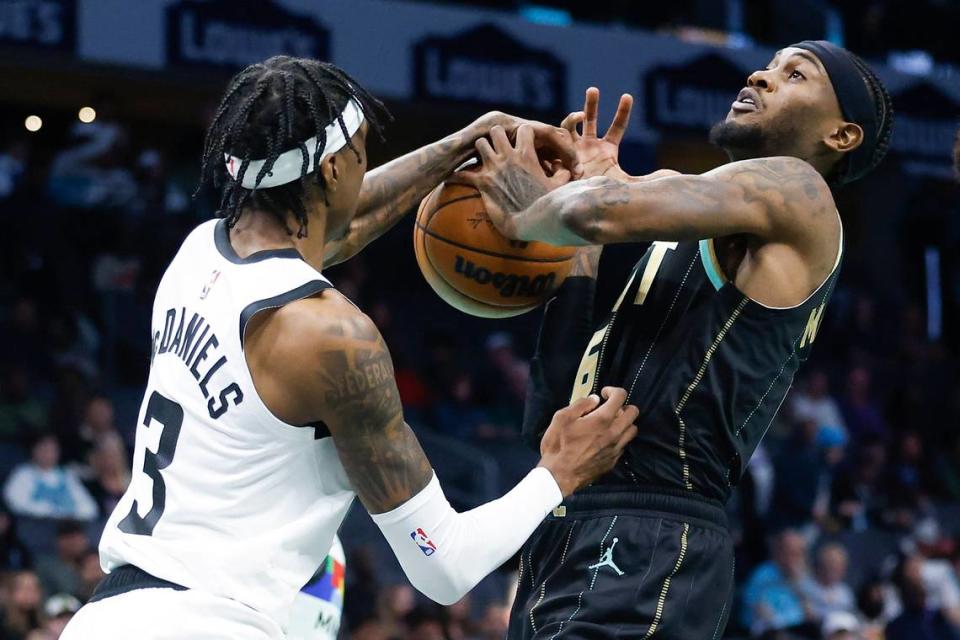 Minnesota Timberwolves forward Jaden McDaniels (3) blocks a shot from his brother Charlotte Hornets forward Jalen McDaniels (6) during a game at Spectrum Center in Charlotte, N.C., Friday, Nov. 25, 2022.