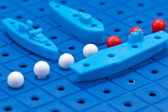Closeup of pieces on a Battleship board game