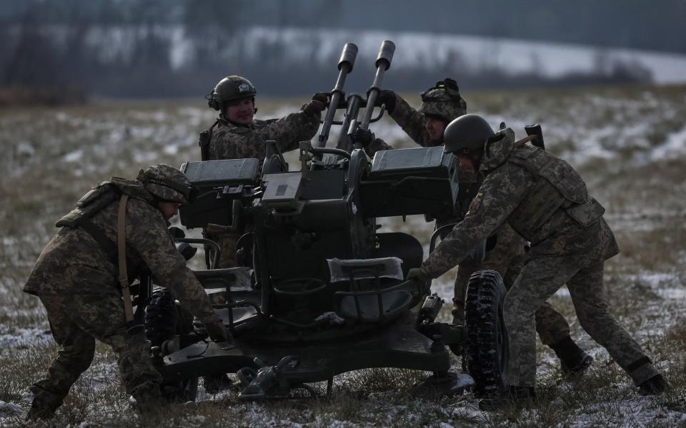 Ukrainian servicemen operate a ZU-23-2 anti-aircraft cannon