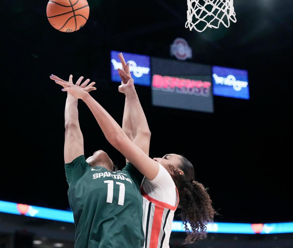 Jan. 14, 2024; Columbus, Ohio, USA; 
Ohio State Buckeyes guard Celeste Taylor (12) blocks a shot by Michigan State Spartans guard Jocelyn Tate (11) during the second quarter of an NCAA Division I basketball game on Sunday at Value City Arena in Columbus.