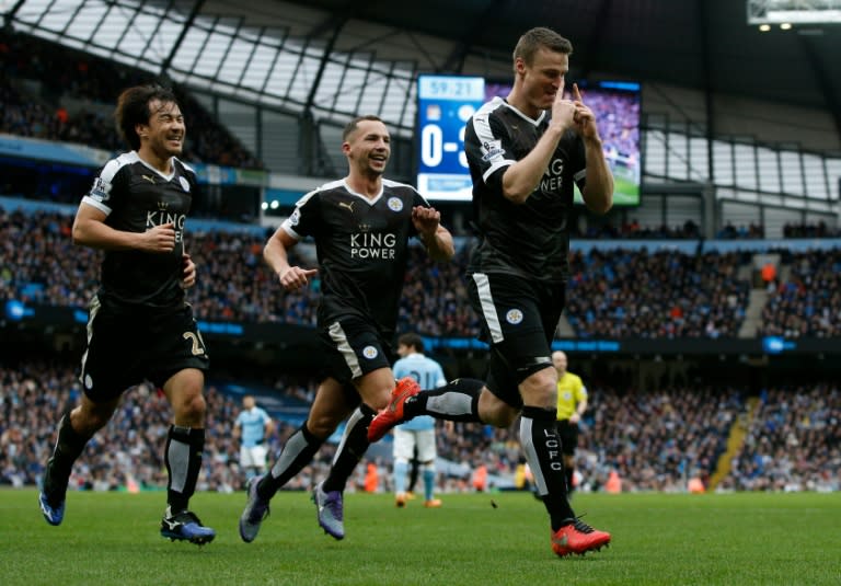 Leicester City's Robert Huth (R) celebrates after scoring his second goal during the match against Manchester City in Manchester, on February 6, 2016