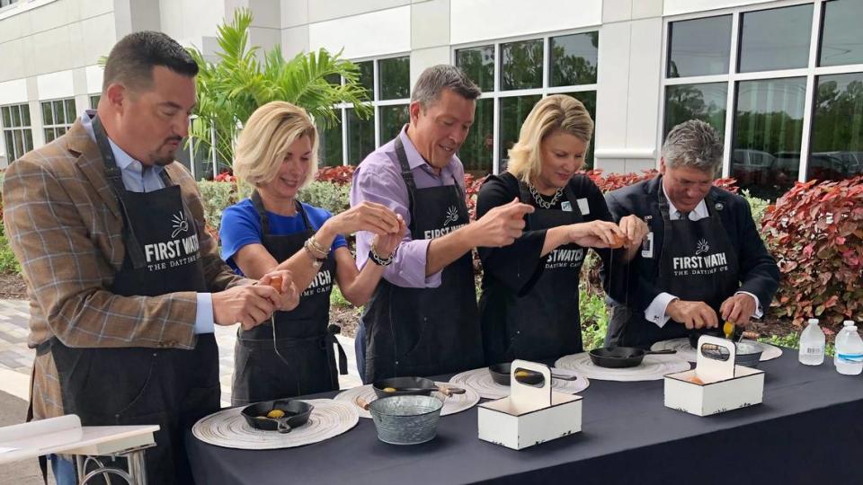 Taking part in the egg-cracking ceremony at the new corporate headquarters of Bradenton-based First Watch restaurants on 7/15/2021, were, from left, Chris Tomasso, Sharon Hillstrom, George Kruse, Jacki Dezelski and Scott Hopes.