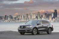 This undated photo provided by Honda shows the 2020 Acura MDX Sport Hybrid, a midsize SUV with an EPA-estimated 27 mpg in mixed driving. (American Honda Motor Co. via AP)