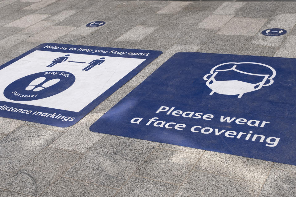 As the third national coronavirus lockdown continues, face mask wearing and social distancing advice signs outside Grand Central station on 30th March 2021 in Birmingham, United Kingdom. After months of lockdown, the first signs that life will start to get back to normal begin, with more people enjoying the company of others in public, as the rule of six starts the first stage of lockdown ending. (photo by Mike Kemp/In Pictures via Getty Images)