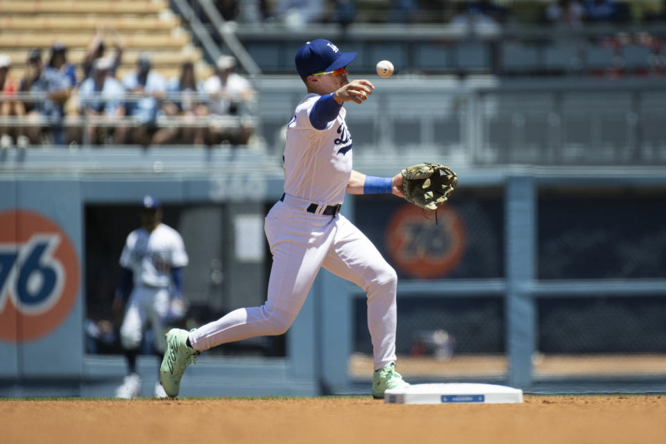 Los Angeles Dodgers second baseman Kiké Hernández throws during the first inning of a baseball game against the Toronto Blue Jays in Los Angeles, Wednesday, July 26, 2023. (AP Photo/Kyusung Gong)