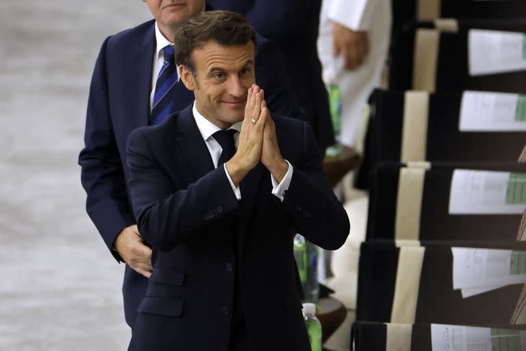 French President Emmanuel Macron gestures as he attends the Qatar 2022 World Cup semi-final football match between France and Morocco at the Al-Bayt Stadium in Al Khor, north of Doha on December 14, 2022. (Photo by Odd ANDERSEN / AFP)