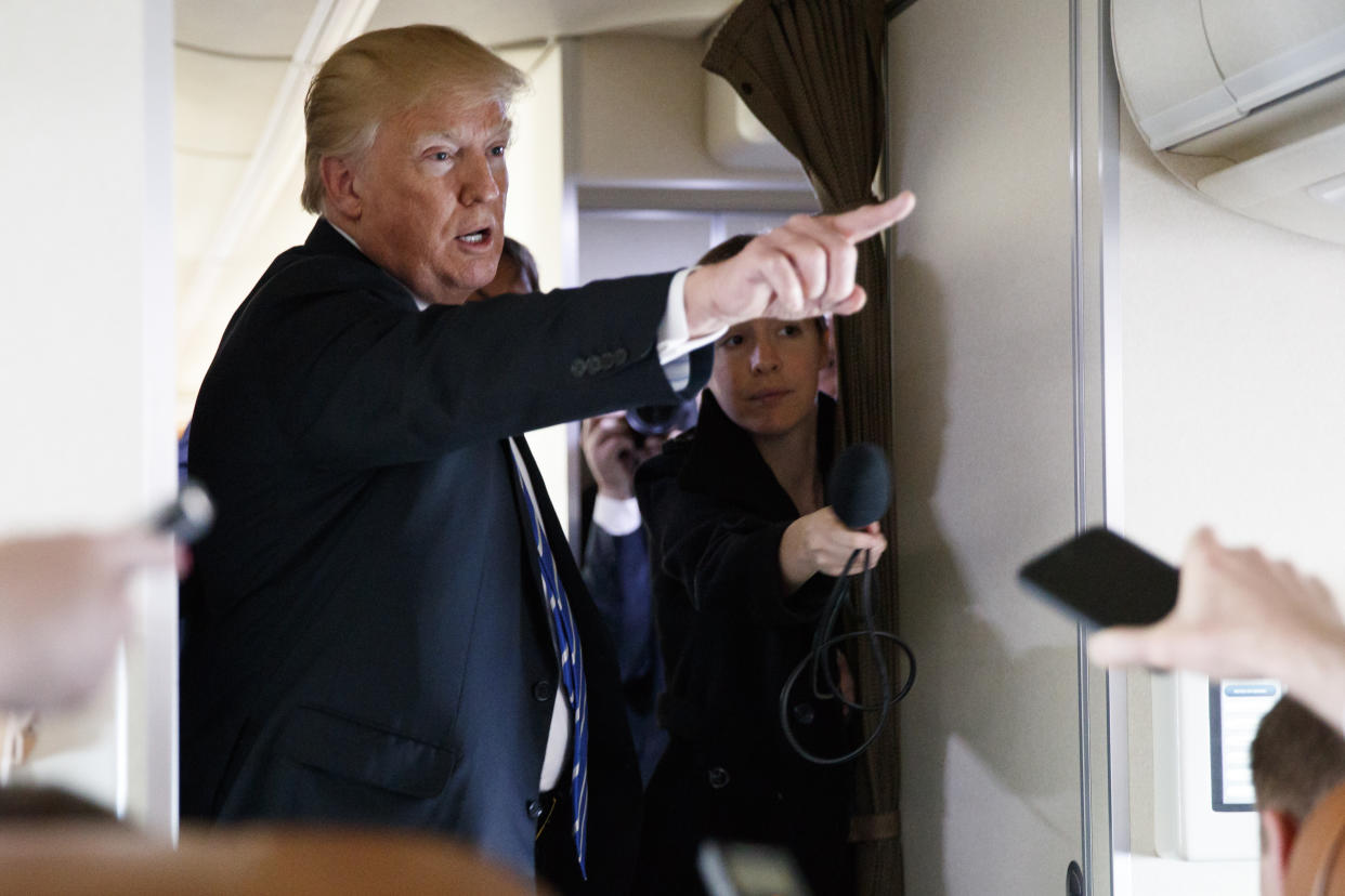 President Trump talks with reporters aboard Air Force One on April 5, 2018, after a roundtable event in White Sulphur Springs, W.Va. (Evan Vucci/AP)