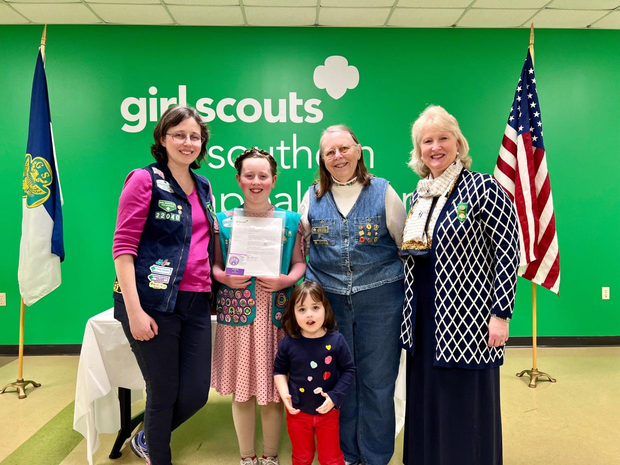 Mom and troop co-leader Cassie Ogle, sisters Gracie and Eleanor, grandma Bobbie Redcorn and Girl Scouts of Southern Appalachians CEO Lynne Fugate smile for a photo at Gracie Ogle’s award ceremony. All are former, present, or future Girl Scouts. Gracie Ogle is the only Girl Scout in the state of Tennessee to win the Girl Scouts Space Science Investigator Badge in the “Girl Scouts to the Moon and Back” essay-writing contest. March 16, 2023