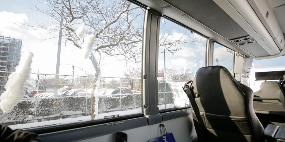 Large windows show snow falling down the side of the window.