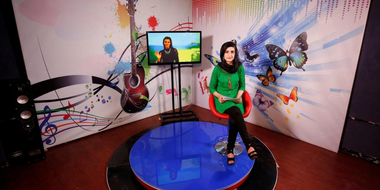 A female TV presenter works without a headscarf in Kabul in May 2017