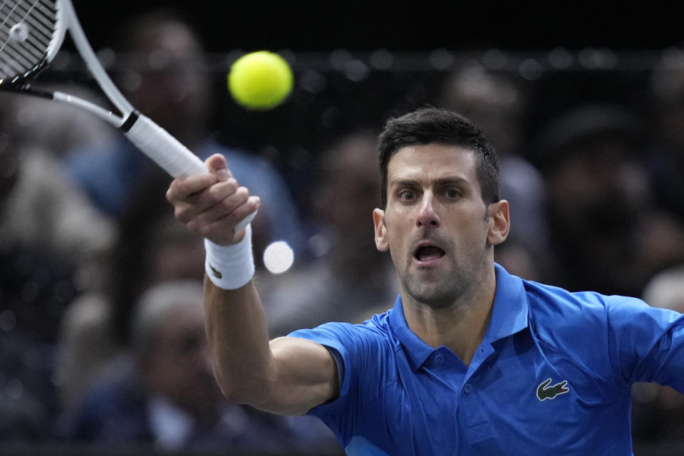 Serbia's Novak Djokovic returns the ball to Denmark's Holger Rune during their Paris Masters final at the Accor Arena, Sunday, Nov. 6, 2022 in Paris. (AP Photo/Thibault Camus)