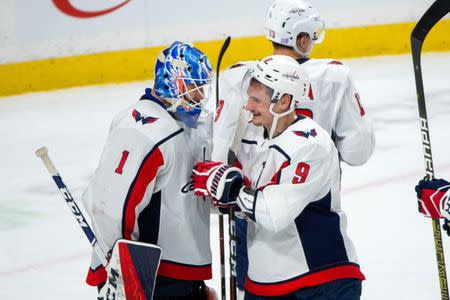 Nov 13, 2018; Saint Paul, MN, USA; Washington Capitals defenseman Dmitry Orlov (9) congratulates goalie Pheonix Copley (1) after the game against Minnesota Wild at Xcel Energy Center. Brad Rempel-USA TODAY Sports