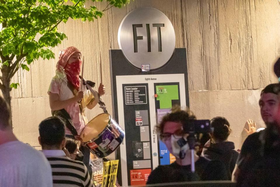 An anti-Israel protesters bangs on a drum outside FIT on West 27th Street near 8th Avenue in Manhattan on Tuesday. NY Post