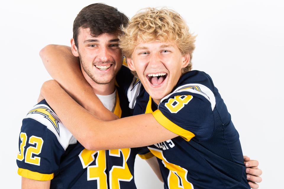 Littlestown football players Zyan Herr (32) and Alex Popoff (8) pose for a photo during YAIAA football media day on Tuesday, August 1, 2023, in York.