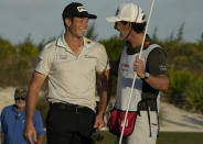 Norway's Viktor Hovland, left, celebrates with his caddy after winning the Hero World Challenge PGA Tour at the Albany Golf Club in New Providence, Bahamas, Sunday, Dec. 4, 2022. (AP Photo/Fernando Llano)