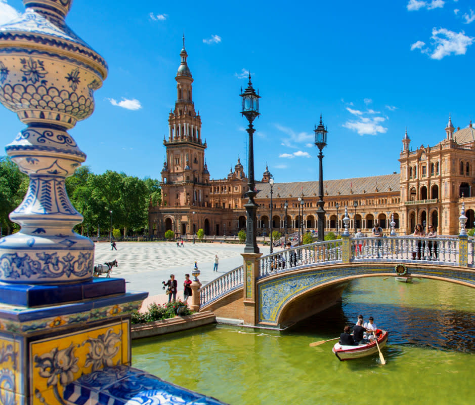 Andalusia's capital, Seville ("Seveeya"), oozes Southern Spain with its deep blue skies, charming café-lined squares (tapas was born here, say Sevillanos), and grand architecture—including the world's largest Gothic cathedral.<p>Sylvain Sonnet/Getty Images</p>