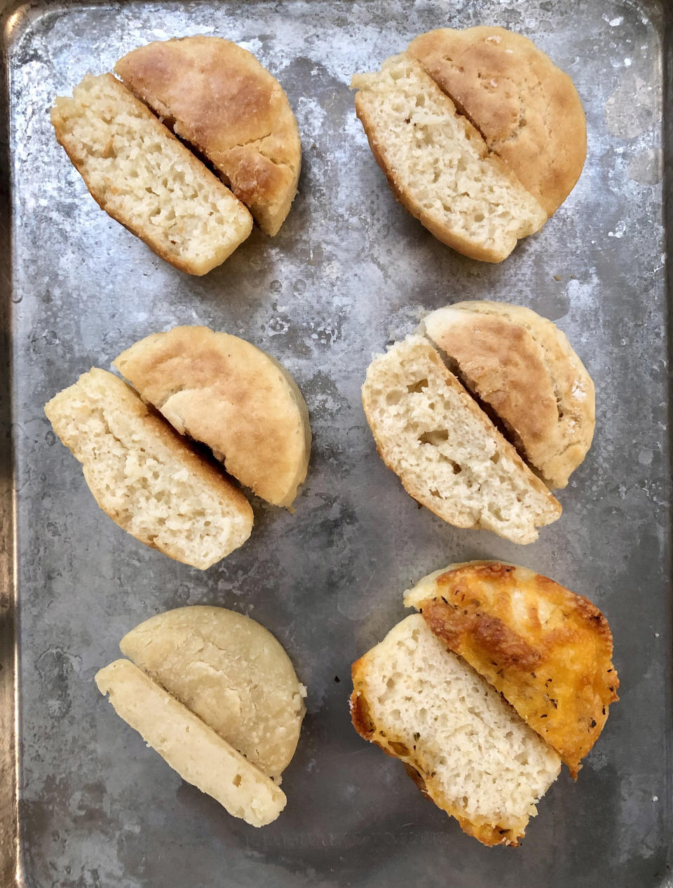 The mayo roll recipe with (from top, left to right): double the mayo, half the mayo, more milk, no oiling of the pan, non-self-rising flour and cheddar-topped. (Courtesy Heather Martin)