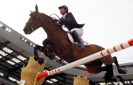 FILE PHOTO: France's Patrice Delaveau riding Orient Express HDC competes in the jumping first round third competition at the World Equestrian Games at the d'Ornano stadium in Caen, September 6, 2014. REUTERS/Regis Duvignau/File Photo