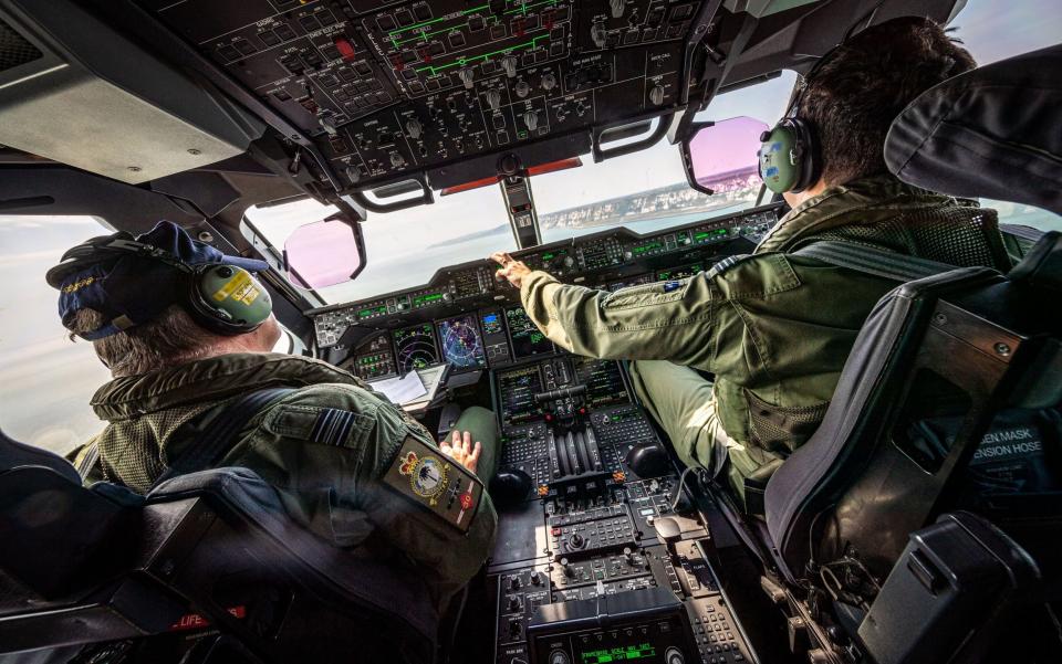 The crew of a Royal Air Force aircraft observe the coastline of Dover in order to identify potential migrants coming across the Channel from France - Cpl Ed Wright RAF/MoD/PA