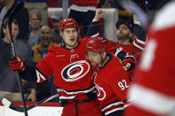 Carolina Hurricanes' Martin Necas, left, celebrates his goal with teammate Evgeny Kuznetsov (92) during the second period of an NHL hockey game against the Detroit Red Wings in Raleigh, N.C., Thursday, March 28, 2024. (AP Photo/Karl B DeBlaker)