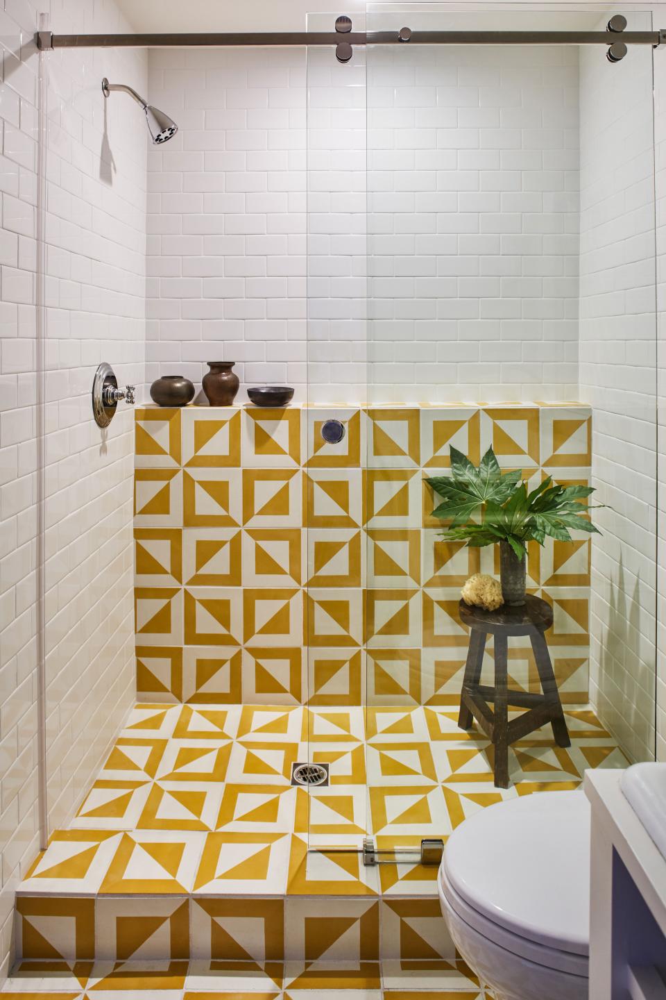 “My favorite color is yellow because it exudes so much joy,” Tony says of the Granada tiles in the guest house bathroom. Does he ever go over there just to shower? “You know what? I do actually,” he says.