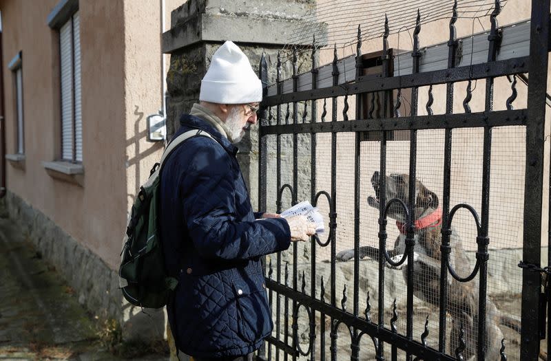 Volunteer, Nogradi distributes the samizdat-like leaflets called Nyomtass Te Is! (You Should Print, Too!) in Dunabogdany