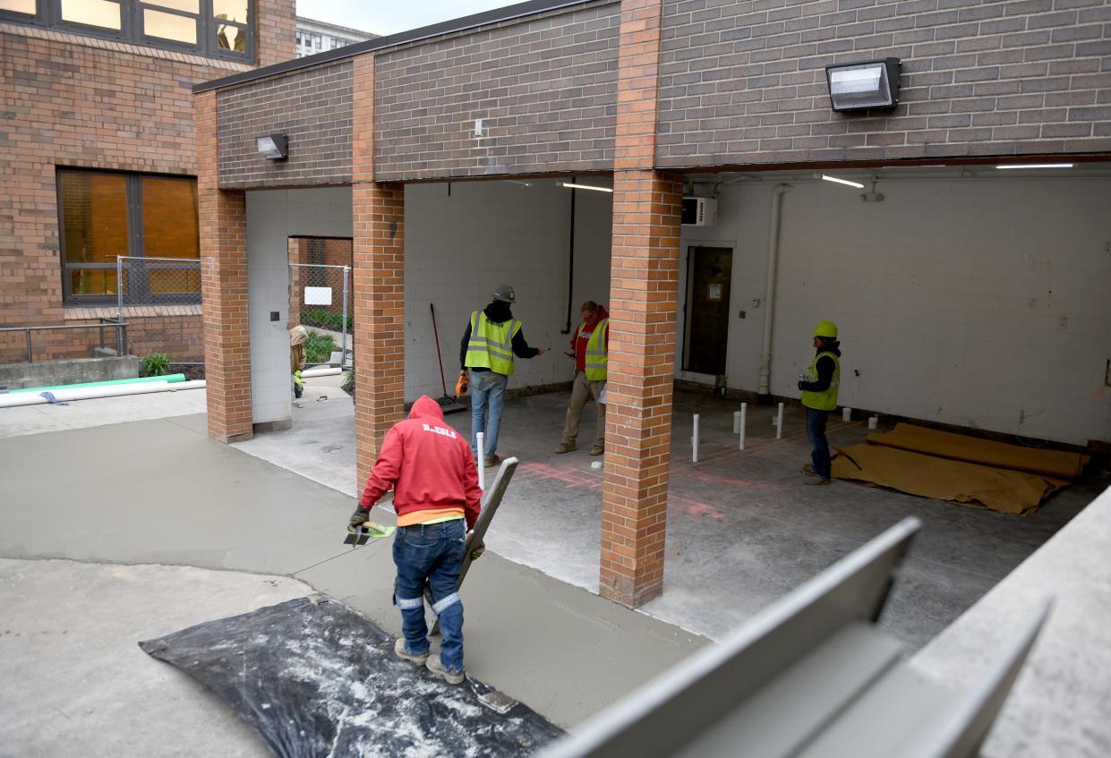 Roseman Construction employees work on the Court Services Building in downtown Massillon. The city is remodeling the facility, also known as the Getz Building. New handicap-accessible restrooms are part of the $250,000 upgrade.