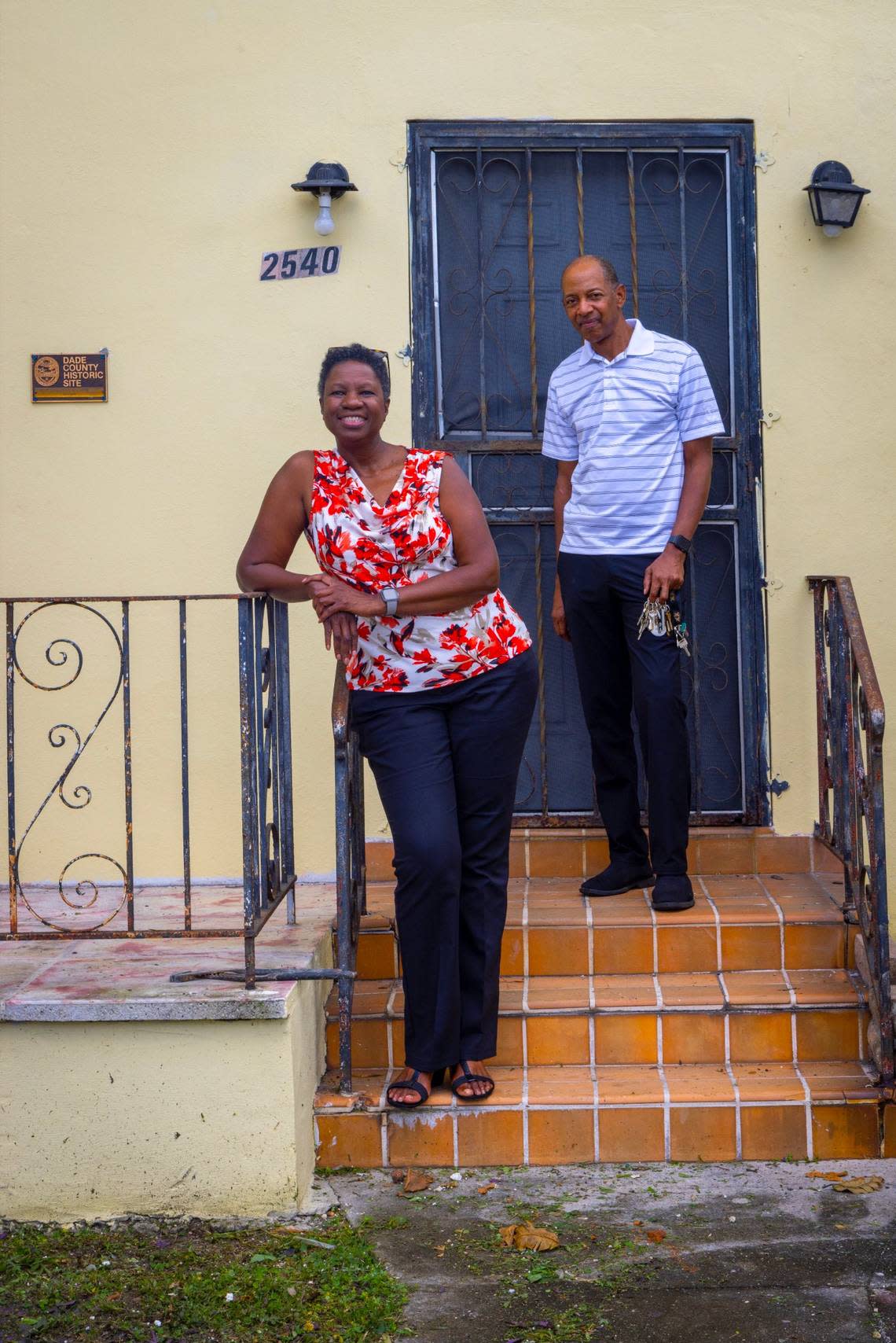 On Monday, Jan. 30, 2023, Kim Johnson, left, director of Georgette’s Tea Room House, said she hopes to raise $800,000 to restore the historic Black Brownsville landmark. She’s on its grounds with Donald L. Burden, the pastor at the Bethany Seventh-day Adventist Church. The church owns the house.