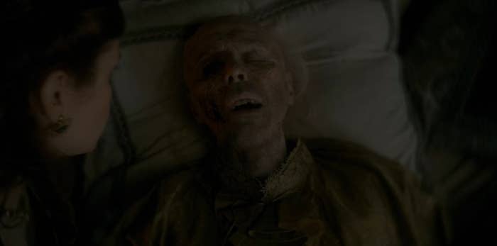 Viserys dying in bed with Alicent watching over him