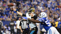 <p>Jacksonville Jaguars Blake Bortles (5) releases a pass under pressure from Indianapolis Colts linebacker Barkevious Mingo (52) at Lucas Oil Stadium. Mandatory Credit: Thomas J. Russo-USA TODAY Sports </p>