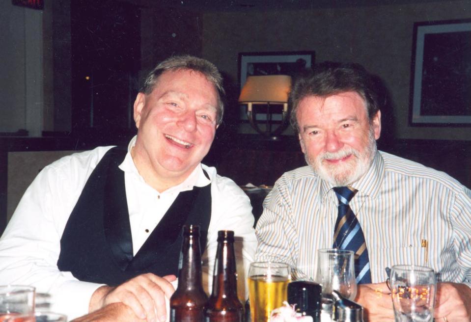 The late Gerhardt Zimmermann, former conductor of the Canton Symphony Orchestra, is shown with Sir James Galway, an acclaimed flutist.