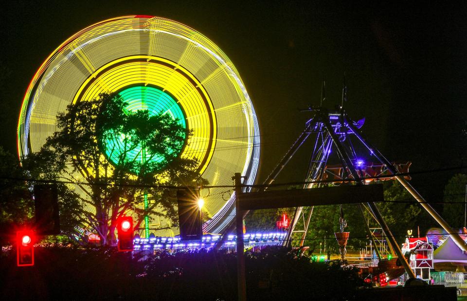 Lights on a ride at the Great Anderson County Fair appear blurred with an eight-second time exposure on the first day of the Anderson Sports and Entertainment Complex in Anderson, S.C. Thursday, May 2, 2024.