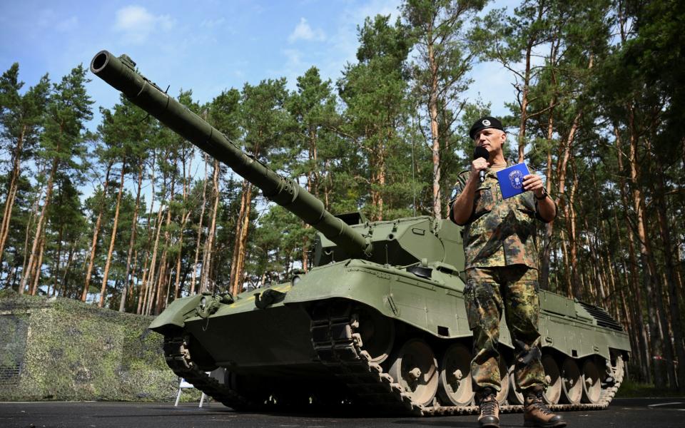 Lieutenant General Andreas Marlow, head of the German Elements MN Corps/Basic Military Organisation at Strausberg, speaks next to a Leopard 1A5 main battle tank