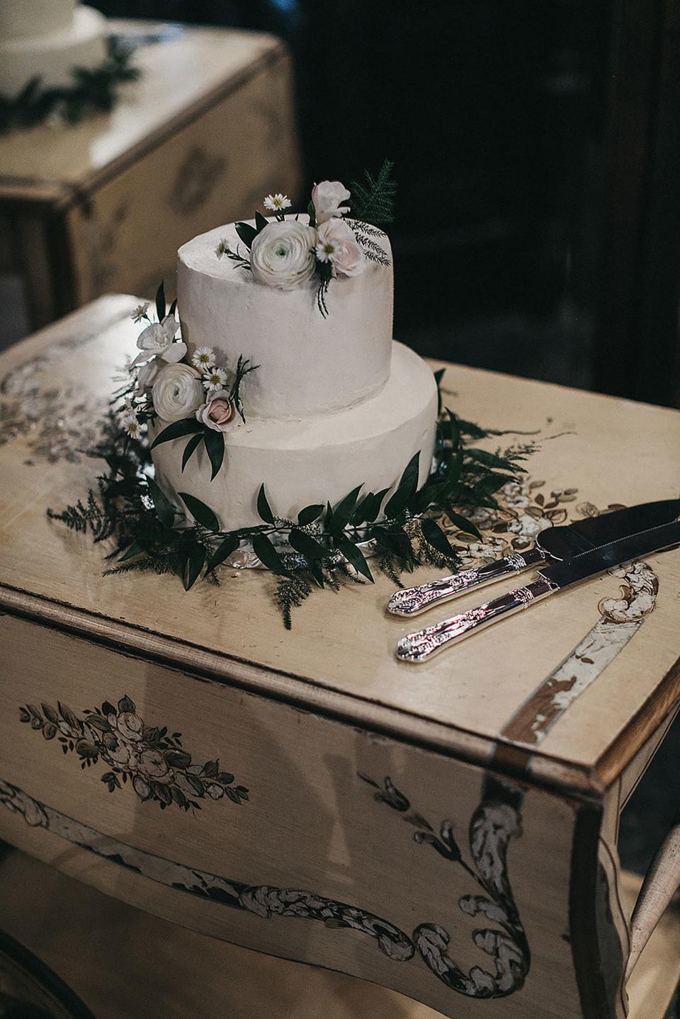 Our wedding cake was made and flown over from Portland by our dear friend Heather Memarian. She iced it at her hotel in New Orleans, and it was decorated with flowers from Leaf and Petal.