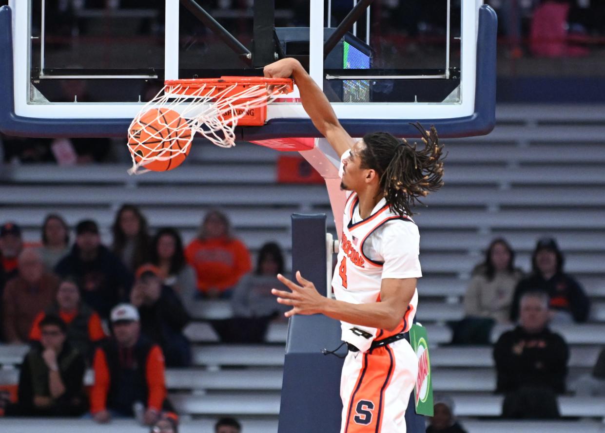 Syracuse Orange forward Chris Bell (4) dunks the ball in the first half against the Boston College Eagles at the JMA Wireless Dome.