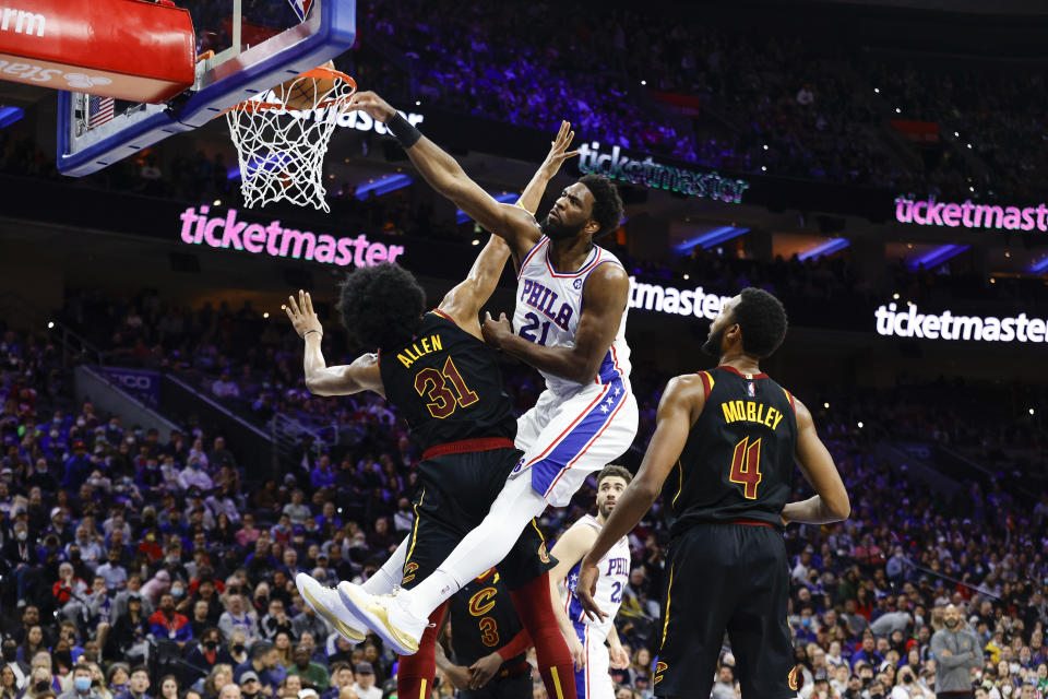 PHILADELPHIA, PENNSYLVANIA - FEBRUARY 12: Joel Embiid #21 of the Philadelphia 76ers dunks over Jarrett Allen #31 of the Cleveland Cavaliers during the second quarter at Wells Fargo Center on February 12, 2022 in Philadelphia, Pennsylvania. NOTE TO USER: User expressly acknowledges and agrees that, by downloading and or using this photograph, User is consenting to the terms and conditions of the Getty Images License Agreement. (Photo by Tim Nwachukwu/Getty Images)