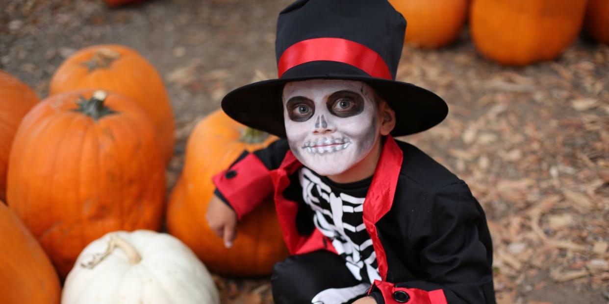 diy skeleton costume on boy in pumpkin patch