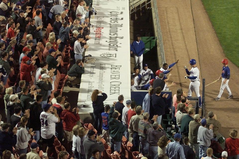 Iowa Cubs pitcher Mark Prior is greeted with loud applause and a jubiliant dugout after hitting his second home run of the game against Tucson on May 7, 2002, at Principal Park.