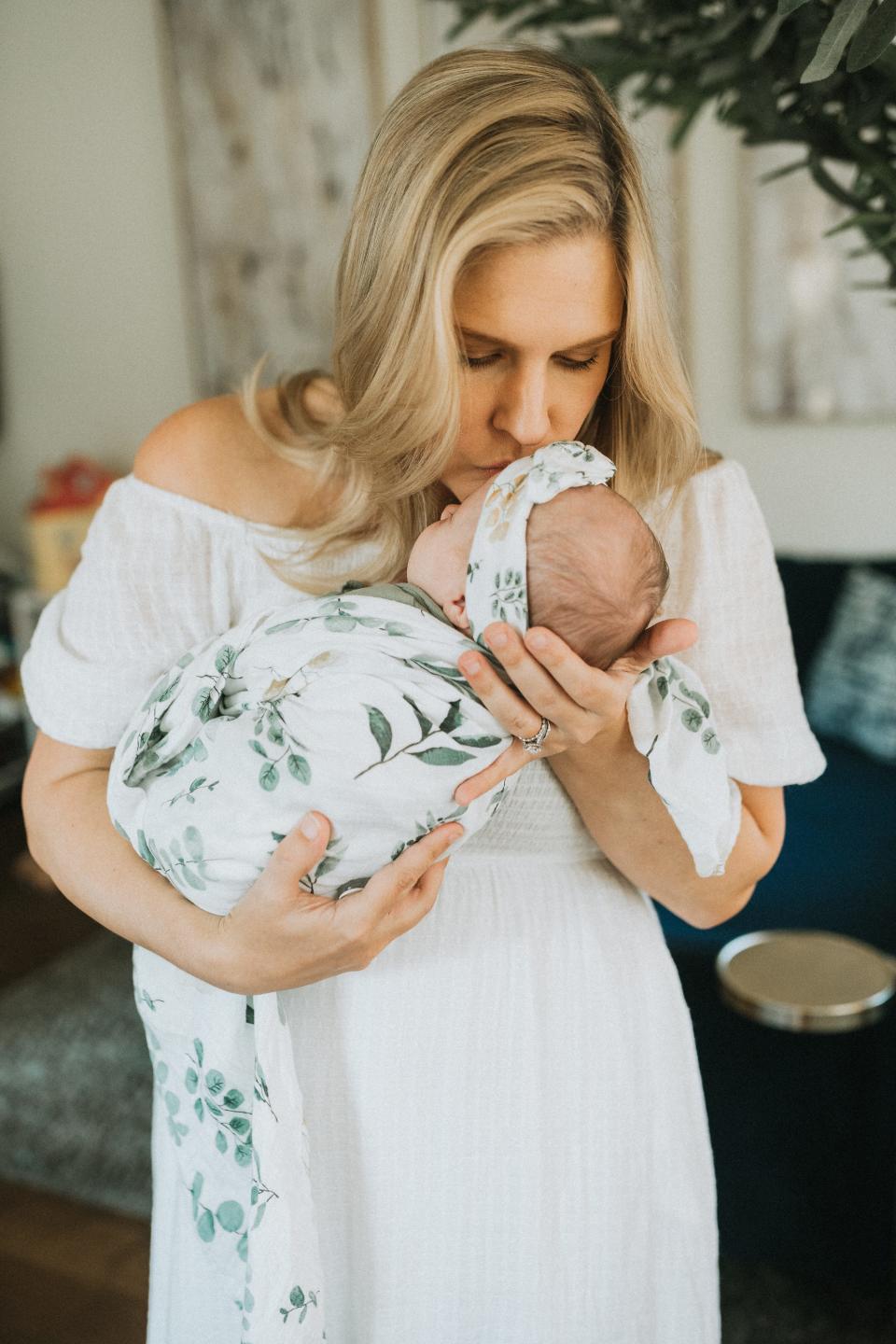 Kaitlyn Kash holds her newborn daughter in her Austin home. Kash joined Zurawski v. Texas as a plaintiff Nov. 14.