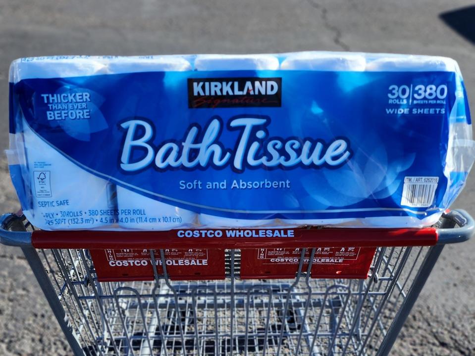 Package of Kirkland bath tissue in a shopping cart