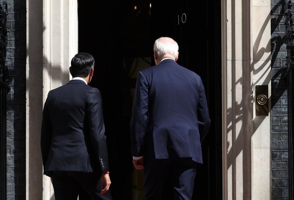 Prime Minister Rishi Sunak (L) and US President Joe Biden (R) enter 10 Downing Street (EPA)