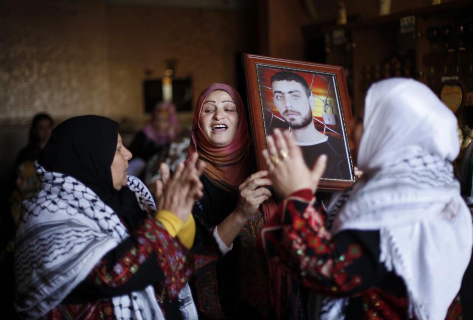 Relatives of Palestinian prisoner Barbakh celebrate ahead of his expected release in Khan Younis