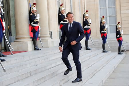 Le Drian, Vitorino, Castaner, Macron, Avramopoulos and Grandi deliver a joint statement at the Elysee Palace in Paris